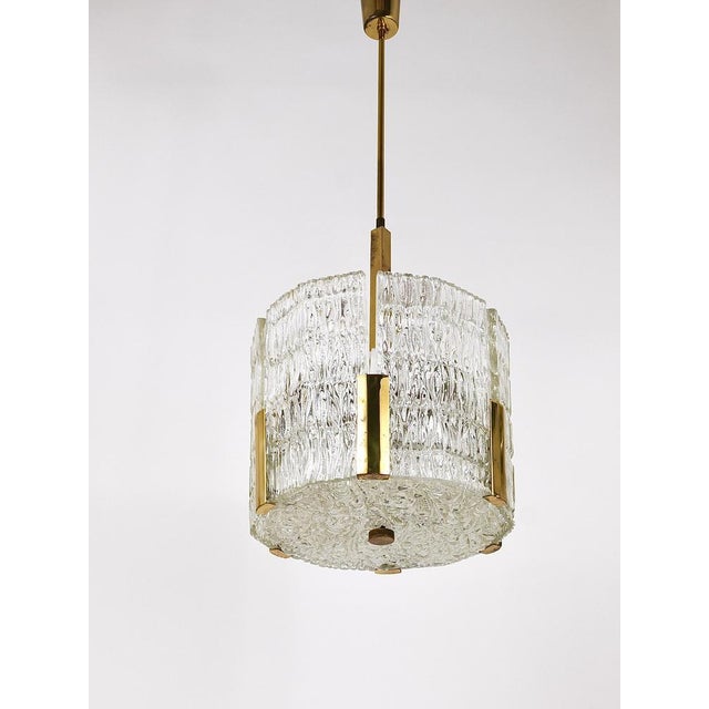 A beautiful midcentury brass drum chandelier from the 1960s, executed by j.t. Kalmar, vienna/austria. Consists of a metal...