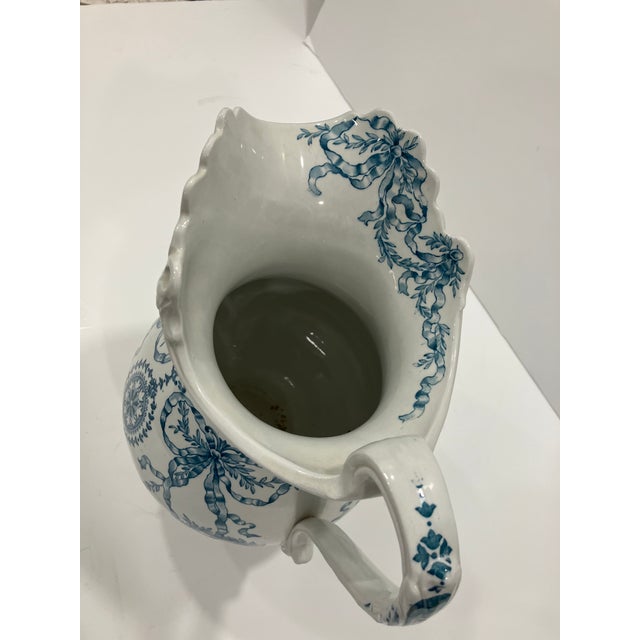 This antique ironstone pitcher was made in England by Dudson Wilcox & Till in 1900 The transfer pattern is called “Gloria”...