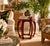 Elegant vintage hexagonal side table by Baker Furniture, featuring a rich red lacquer finish and beautifully sculpted...