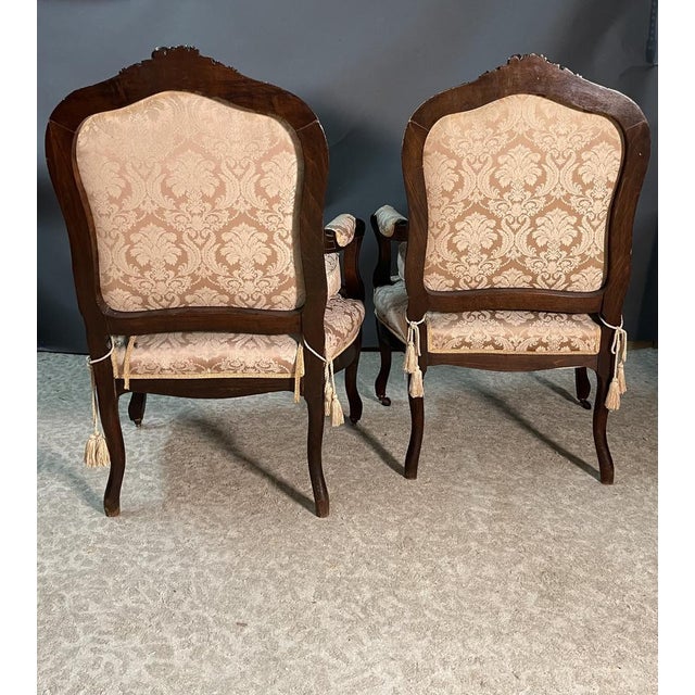 This beautiful pair of 19th Century armchairs in the French Louis XV style, features a comfortably curved and enveloping...