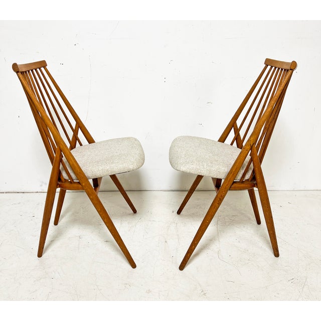 A pair of "Flamingo" spindle chairs designed by Thea Leonard for Nässjö Stolfabrik, Sweden, circa 1950s.