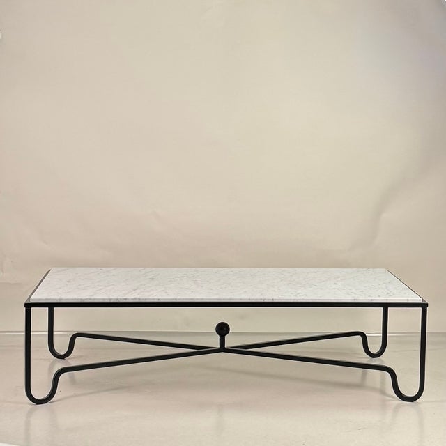 The simple, elegant Design Frères 'Entretoise' bent iron table. Available here in large coffee table size fitted with a...