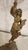 A monumental vintage thirteen-light electrified candelabrum rendered in heavily ornamented cast brass. The central...