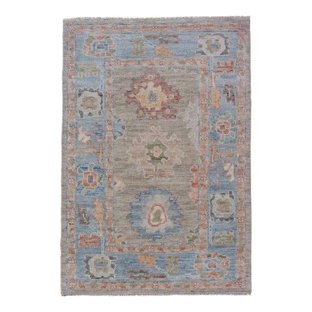 Modern Floral Oushak With Sandy-Brown Background and a Sky Blue Border 2'7" X 4'0" For Sale