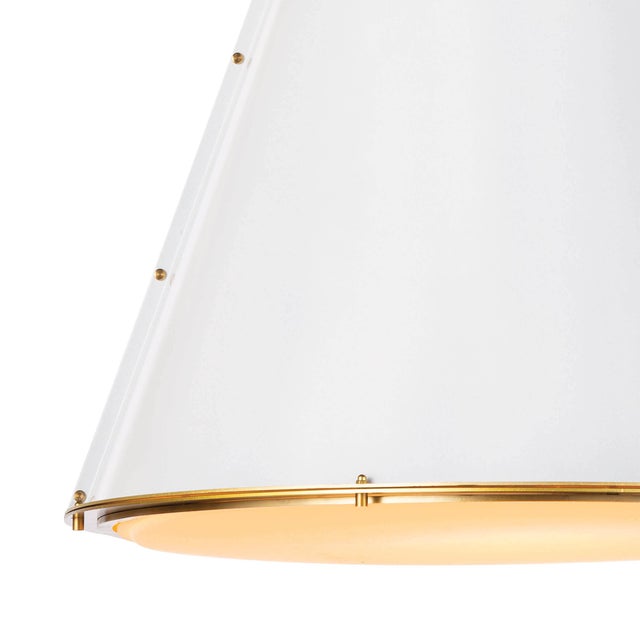 Bright and white, the French Maid chandelier has a simple cone silhouette that’s trimmed with natural brass detailing for...