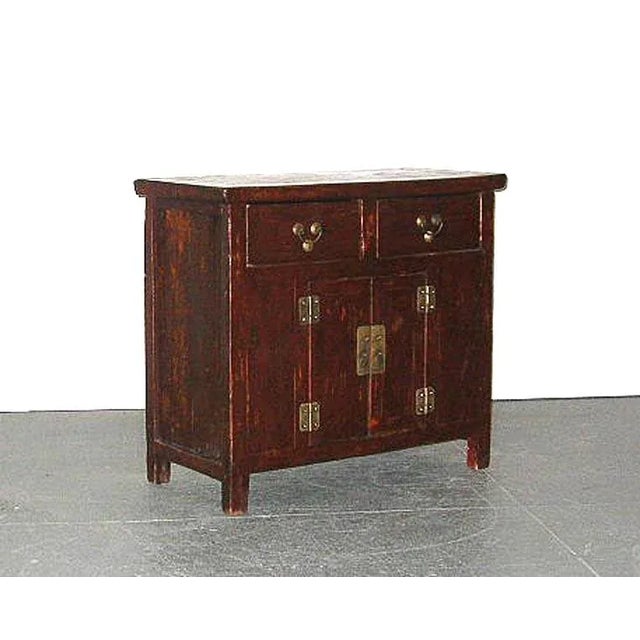An unusual small antique Chinese Northern country-style recessed cabinet/sideboard with two drawers and two side-opening...