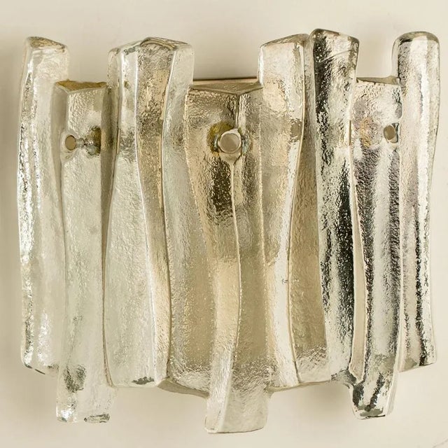 Beautiful and elegant modern wall lights in the style of kalmar in the 1970s. A lovely design. Nine thick, textured glass...