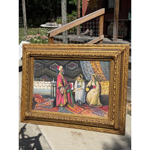This captivating and large-scale vintage oil painting on canvas depicts a richly layered ottoman-inspired interior scene....