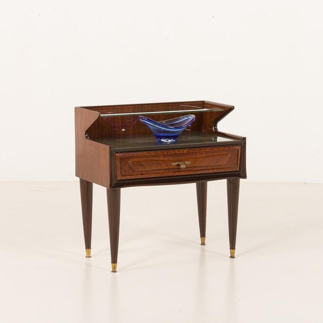 The Italian mid-century side table, very reminiscent of Paolo Buffa projects from the same period, was manufactured some...