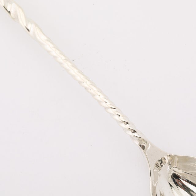 This Arts and Crafts Movement Sterling Silver Square Twist Sugar Spoon, signed by Whiting Manufacturing Co. and dating to...