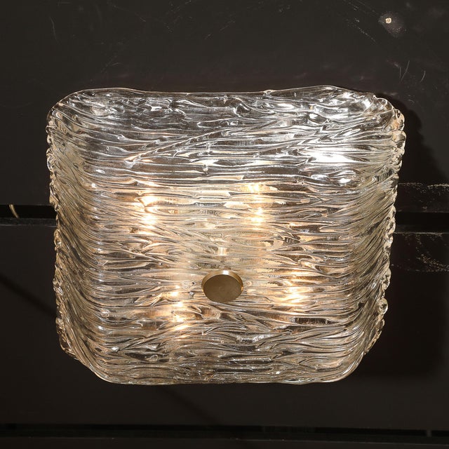 This elegant Mid-Century Murano Hand-Blown Textural Clear Glass Flush Mount Chandelier by Venini originated in Italy,...