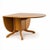 A classic mid-century drop leaf dining table by Morris of Glasgow, showcasing beautifully simple lines and a warm teak...