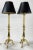 Vintage heavy brass three slipper tripod footed table lamps with original black shades. Measures 29.5"H to top of bulb...