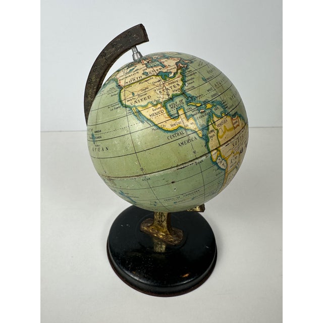 Vintage tin globe. Marked: Reliable Series. Made in England. English-language version. Includes a protractor. Great for...