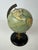 Vintage tin globe. Marked: Reliable Series. Made in England. English-language version. Includes a protractor. Great for...