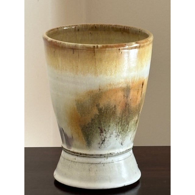 A gorgeous mid- to late-20th century stoneware studio pottery vase. This lovely wide mouth vase features abstract designs...