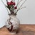 Ceramic ikebana with a lively plum blossom (Ume) decoration, Seiho Kiln. Kotobuki ware (寿焼) is Japanese ceramics produced...
