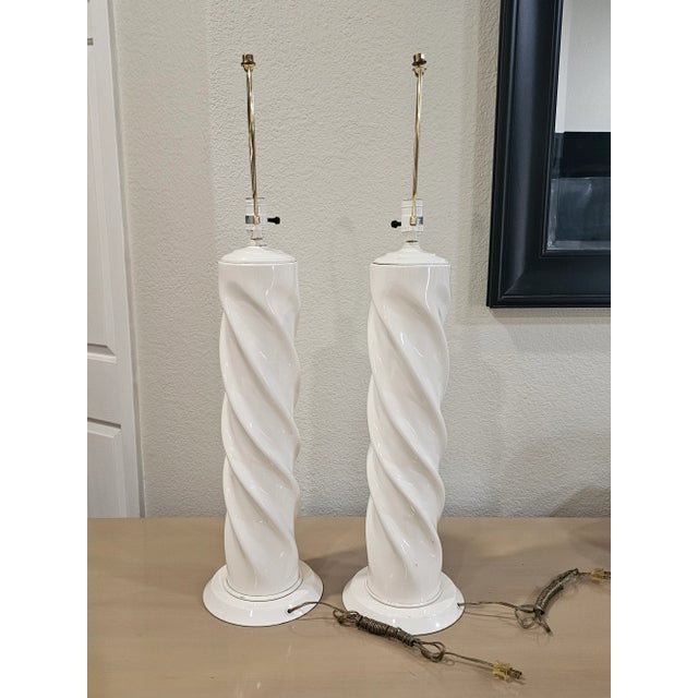 Postmodern white ceramic twist lamps. Circa 1970. Styled after Michael Taylor. These lamps are in fantastic condition. 35...