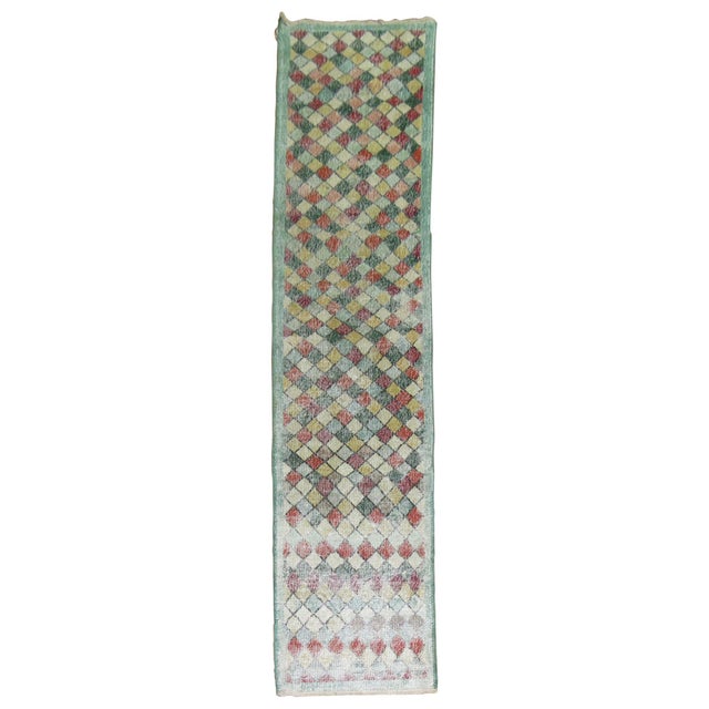 A distressed Turkish runner with an all-over diamond motif. Measures: 2'2" x 10'3".