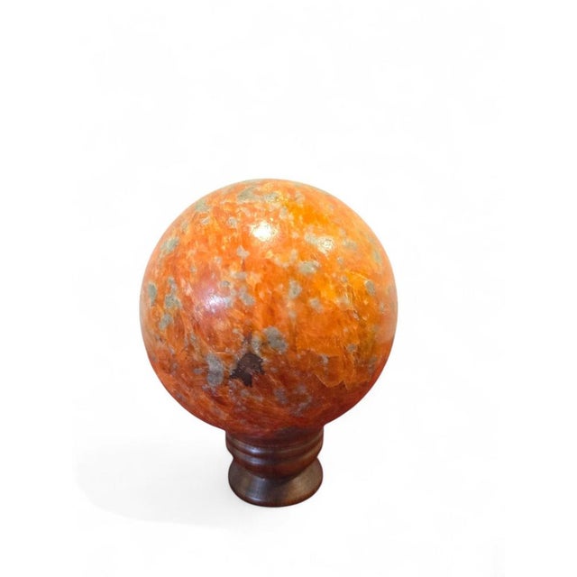 Impressive natural quartz crystal sphere dating from the 1970s, showcasing the timeless beauty and purity of one of...