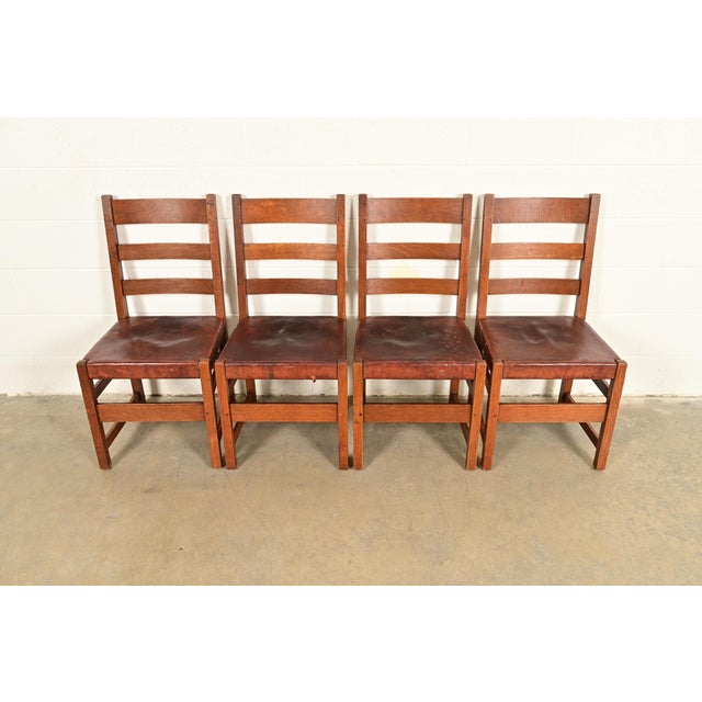 An exceptional set of four antique Mission or Arts & Crafts period ladder back dining chairs By L. & J.G. Stickley USA,...