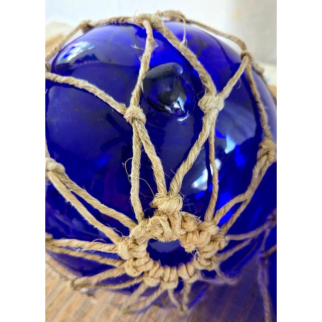 Nautical Vintage Pair of Rare 8" Cobalt Blue Hand-Blown Glass Fishing Floats · Original Jute Net For Sale - Image 3 of 7