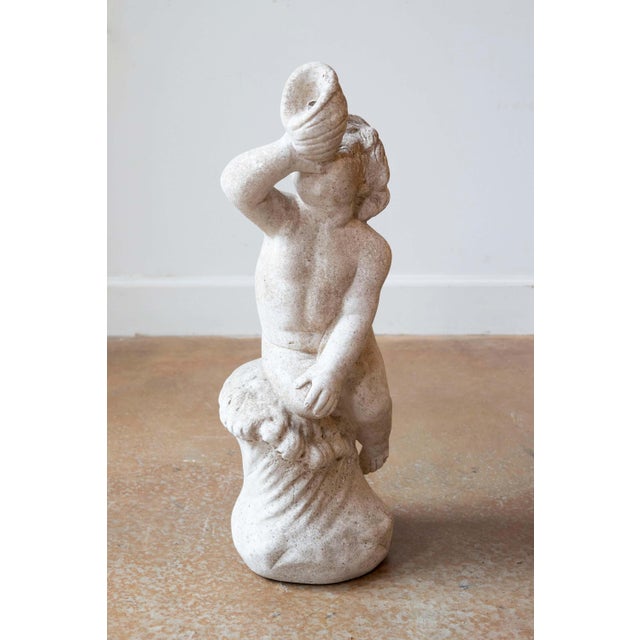 This Swedish 20th-century marble cherub statue exudes timeless charm and elegance, making it a delightful decorative...