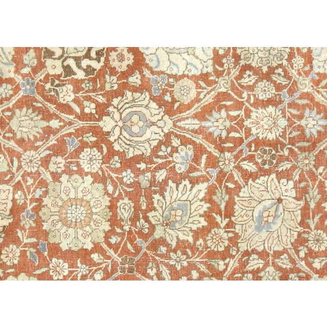 This semi-antique Persian Tabriz rug originates from Northern Iran's renowned weaving region, where master craftsmen...