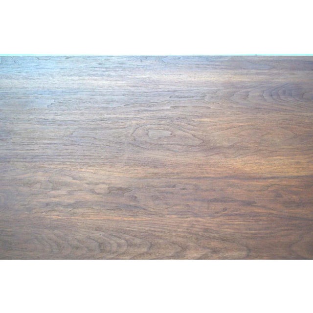 Custom dining table built in aged walnut. This is one of many tables we build to order using hand selected planks. The...