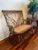 A truly charming and intricate example of turn-of-the-century American wicker craftsmanship, this vintage rattan settee...