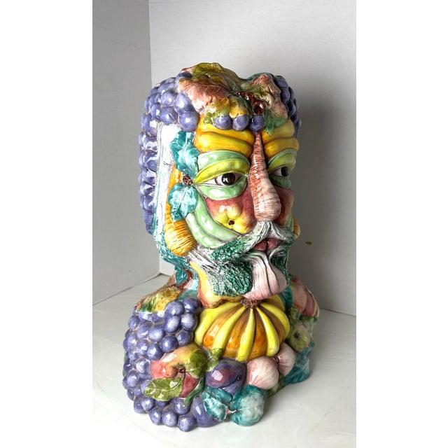 Beautiful Italian glazed bust in the style of 16th century painter Giuseppe Arcimboldo. This colorful bust is adorned with...