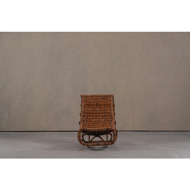 This vintage bamboo slingback lounge chair was produced in Germany during the 1970's. Designed for relaxation, it combines...