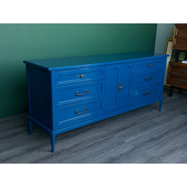 This is a solid built walnut dresser of nine drawers This dresser is newly refinished in high gloss blue lacquer...