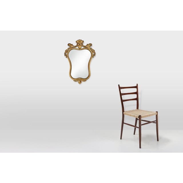 Belgium / 1950 / mirror / wood, mirror / Baroque / Rococo Baroque mirror in gilded wood with rich floral decorations...