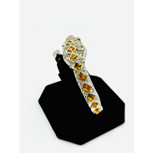 Flash some brilliance with this breathtaking Kenneth Jay Lane serpentine bracelet. Beautifully crafted, it showcases a...