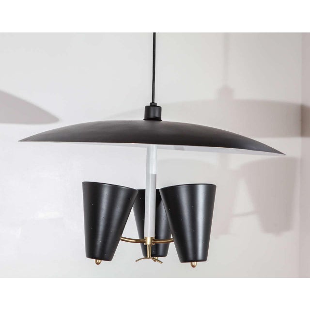 Mid-Century pendant by Ligholier. Black-painted aluminum and brass. Newly rewired for three standard bulbs....
