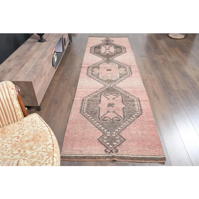 Vintage Turkish Hand-Knotted vintage rug is a semi- vintage runner rug.'70s Eastern region of Turkey's unique rug is...