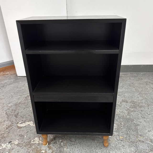Design Plus Gallery presents a Circa 1999 Extendable-Shelf Bookcase from 21st Century Furniture. The upright wood case is...