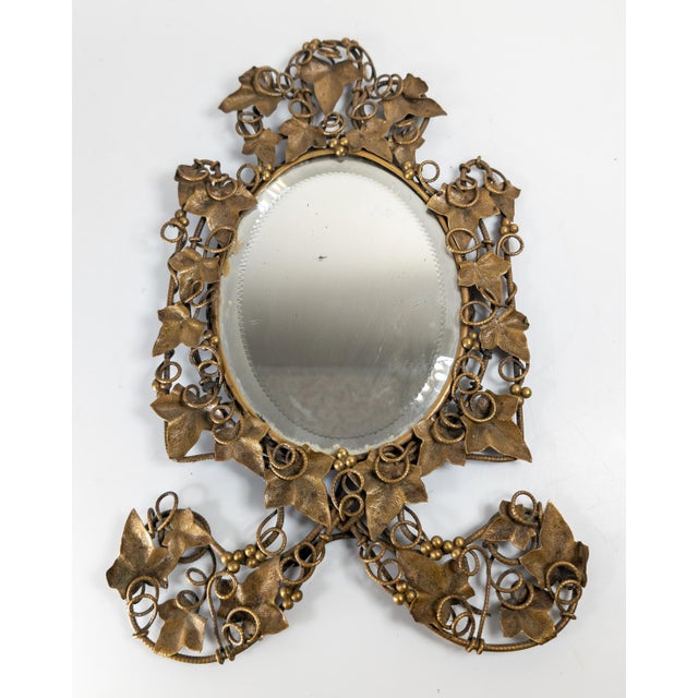 We are selling this beautiful bronze table top mirror with Ivy Vine and berry motif. This piece we believe may be...
