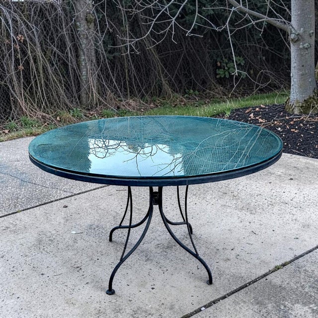 Add mid-century sophistication to your outdoor landscape or interior sunroom with this exceptional vintage round dining...