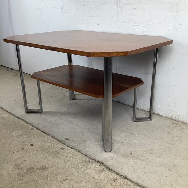 Architectural simplicity and timeless Modern design come together in this striking vintage coffee table, an elegant...