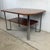 Architectural simplicity and timeless Modern design come together in this striking vintage coffee table, an elegant...