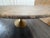 RH Aero Stone Oval Dining Table — 96" Brown Emperador Marble | Antiqued Brass Pedestal Base | Sculptural Oval Design Open...