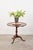 This Georgian pedestal breakfast table features a raised lip edge and classic tilt-top mechanism for easy storage....