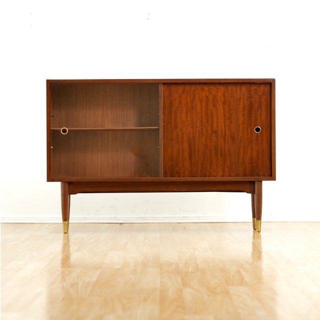 This vintage mid-century china cabinet by Herbert. E Gibbs is a wonderful design and excellent storage piece. Made from...