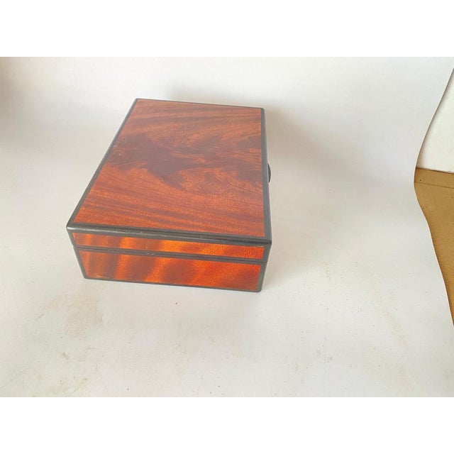 Very nice humidor cigar box, in Burl Wood. This box is large, was made in France in the 1960s. It has a brown and Black...