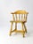 This is a classic captains chair created by Buckstaff of Oshkosh, WI circa mid 20th century. The vibrant yellow stained...