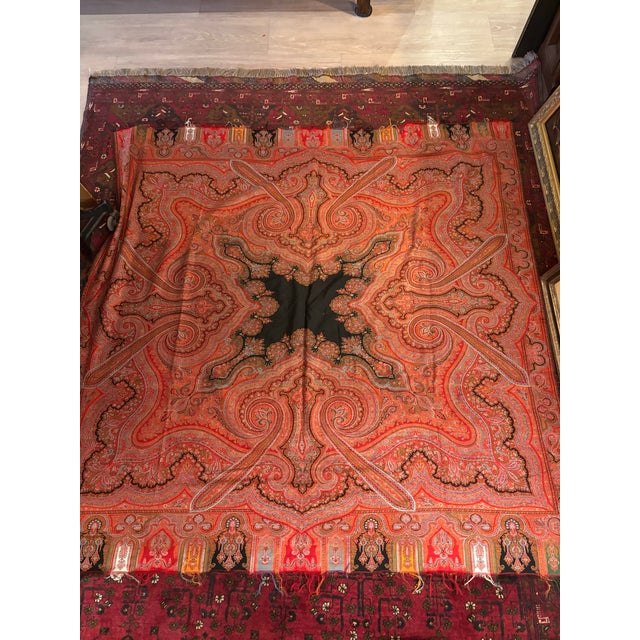 A beautiful and substantial antique 19th-century Indian Kashmir-style paisley shawl featuring an exceptionally intricate...