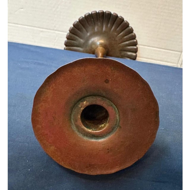 This tall & elegant patinated bronze early Tiffany Studios candlestick dates from circa 1900. It is a wonderfully...