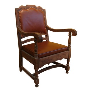 A 19th-Century Carved Oak Diego Armchair With Brown Leather Upholstery For Sale